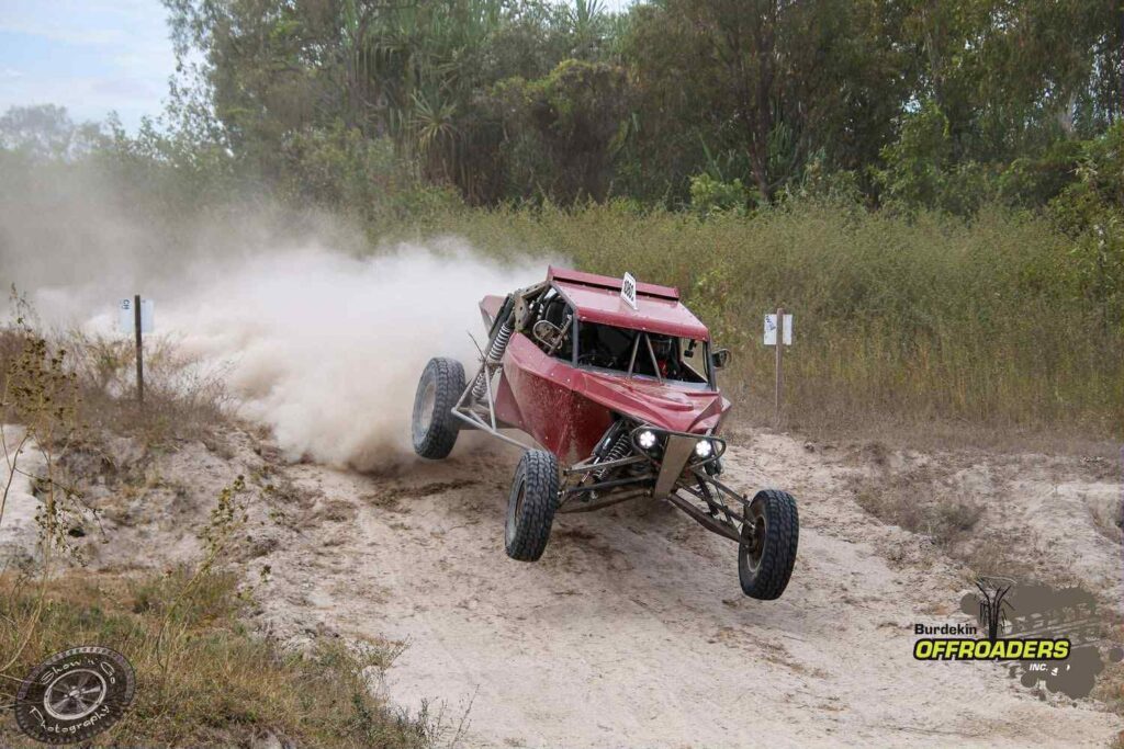 Number 1060 Razorback buggy racing through sand