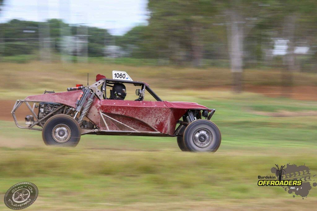 Number 1060 Razorback buggy at speed on short course